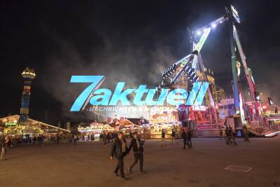 Cannstatter Wasen 2017: Abend-Impressionen und Polizist mit Maschinenpistole am Eingang
